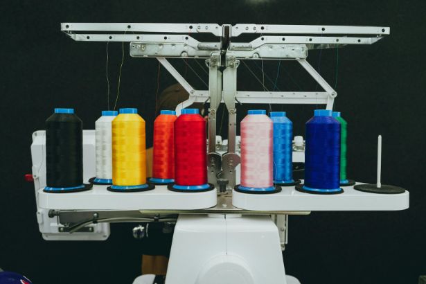 multicoloured threads on an embroidery machine
