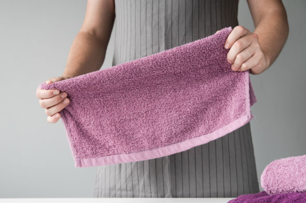 person holding a towel